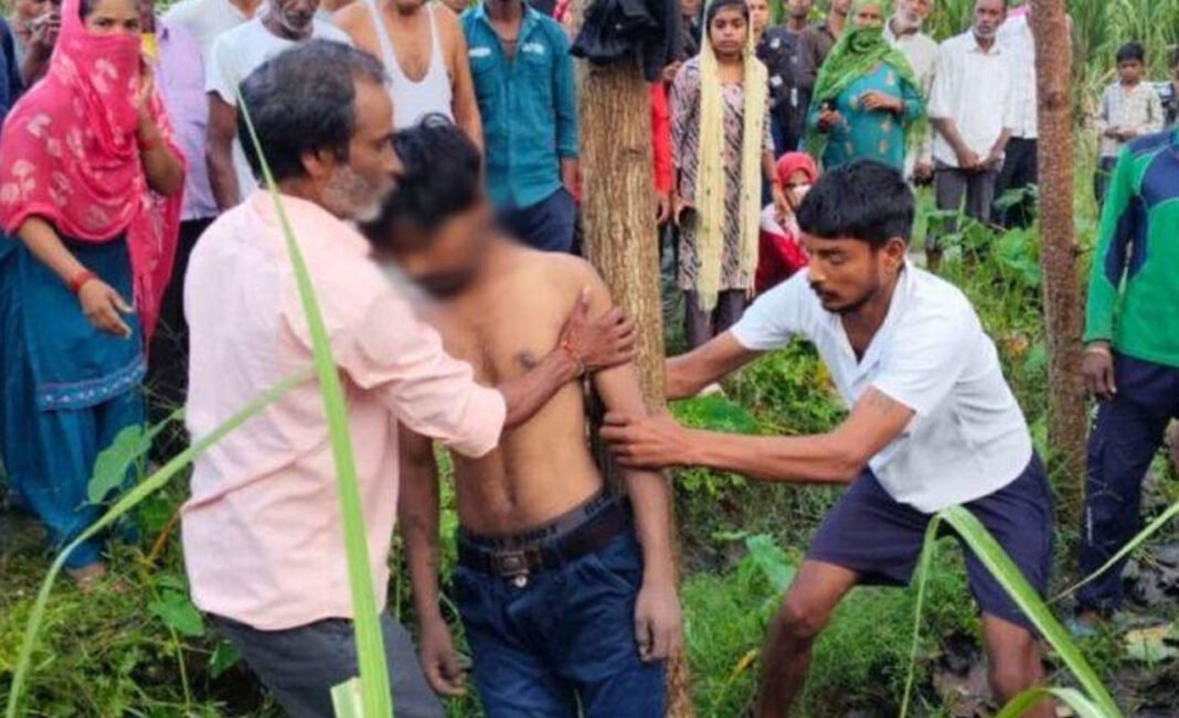 Youth dead body found hanging from a tree