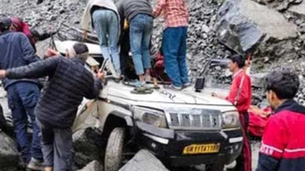 Two killed as boulder falls on vehicle