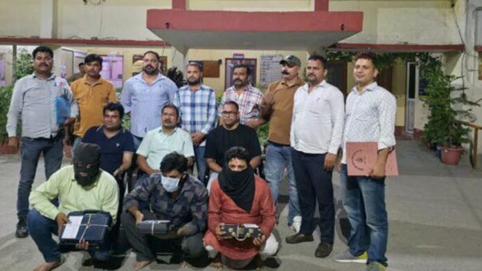 Three arrested for flaunting weapons using fake arms licenses